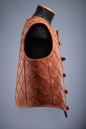 Brown Leather Medieval Armor Vest. Mercenary style torso protection with studded design.の写真素材