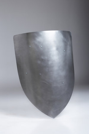 Medieval Knight Templar LARP Shield: Strong Protection for Historical Reenactment. This sturdy steel shield is perfect for LARPing, historical events, and collectors interested in medieval weaponry.の写真素材