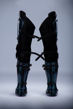 Shiny Steel Medieval Leg Armor. Full leg protection with straps and buckles detail.の写真素材
