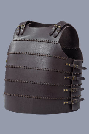 Brown Leather Medieval Torso Armor with Buckles. This brown leather cuirass features adjustable straps and brass buckles, providing torso protection.の写真素材