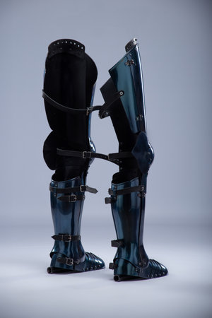 Shiny Steel Medieval Leg Armor. Full leg protection with straps and buckles detail.の写真素材