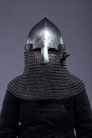 Norman Helmet with Chainmail Aventail. Medieval head protection with nasal bar and attached chainmail neck guard.の写真素材