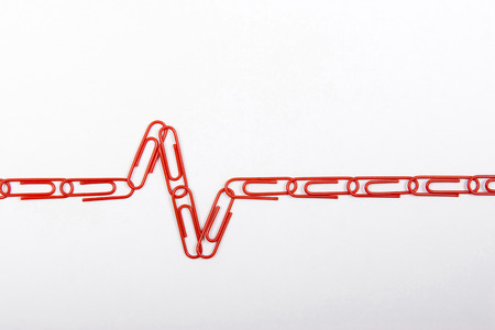 Red plastic-coated paper clips