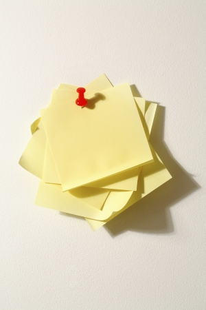 Notes fastened with a map pin
