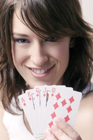Woman holding playing cards
