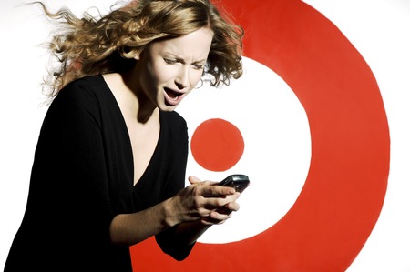 Businesswoman text messaging on her hand phone