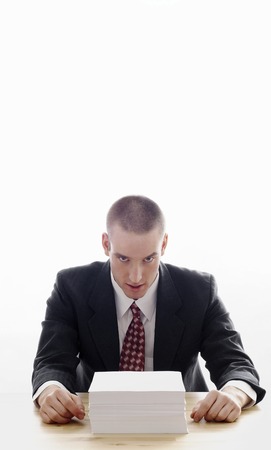 Businessman with a stack of papers on the table