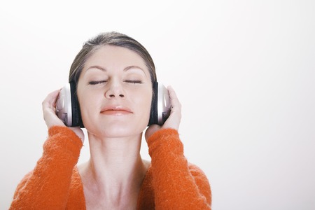 Woman listening to music on the headphones