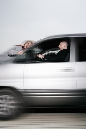 Businessman crashing his car into a man