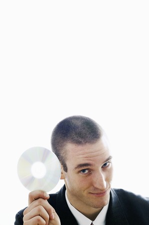 Businessman holding a CD