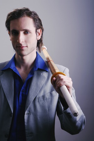 Businessman holding a sword