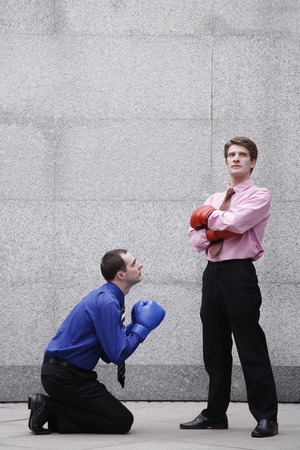 Businessman begging his boss