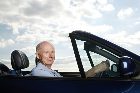 Senior man traveling in the car
