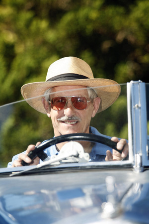 Senior man traveling in the car