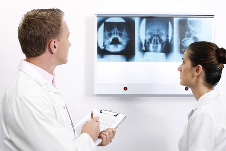 Doctor and nurse looking at X-ray images
