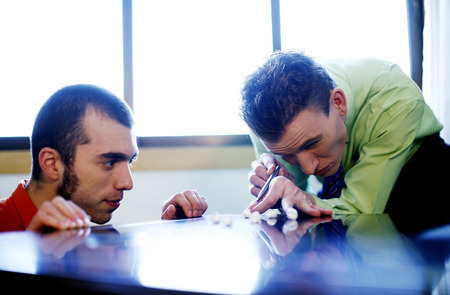 Businessmen playing self-made pool