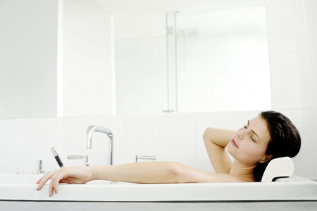 Woman relaxing in the bathtub