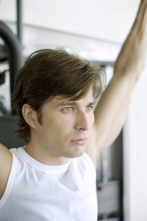 Man exercising on weight machine