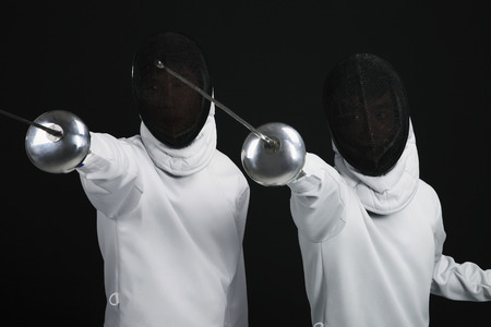 Two men holding fencing foils