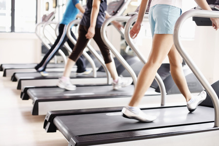 Women running on treadmills
