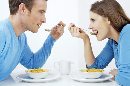 Couple having breakfast togetherの写真素材