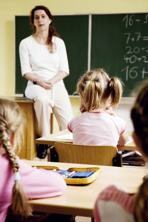 Children and teacher in the classroomの写真素材