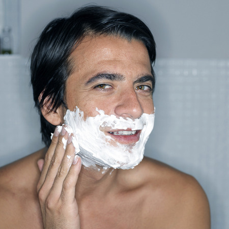 Man applying shaving cream on his faceの写真素材