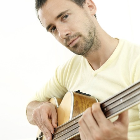 Man plucking guitarの写真素材