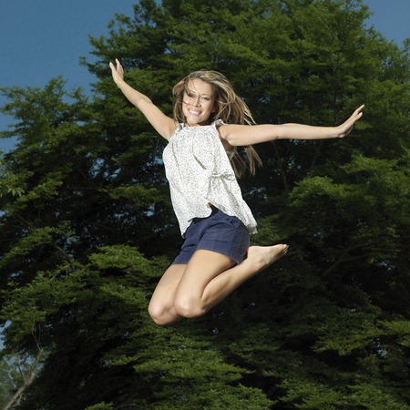 Woman jumping in the airの写真素材