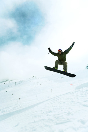 Male snowboarder in airの写真素材