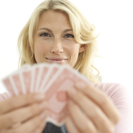 Woman holding playing cards