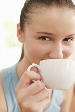 Woman enjoying a cup of coffeeの写真素材