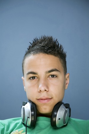 Boy with headphones around his neckの写真素材