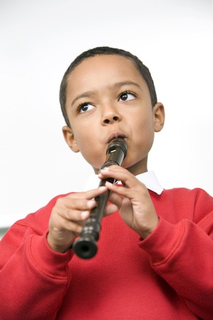 Boy playing the recorderの写真素材