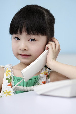 Girl talking on the phoneの写真素材