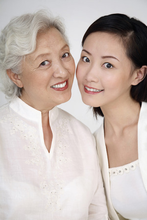 Woman posing with senior womanの写真素材