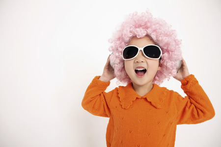 Girl with sunglasses listening to music on the headphonesの写真素材