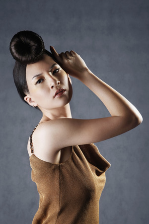 Woman posing in evening dressの写真素材