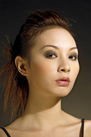 Studio shot of a lady with makeup and hairdoの写真素材