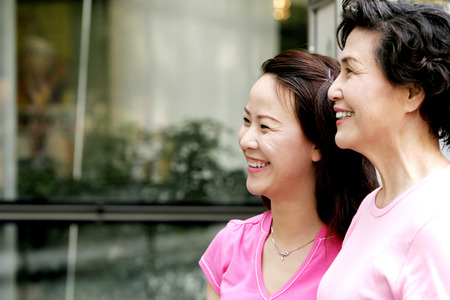 A mother and daughter window shopping の写真素材