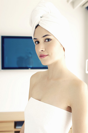 Woman in towel smiling の写真素材