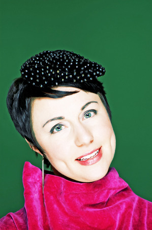 Woman in pink dress smiling の写真素材