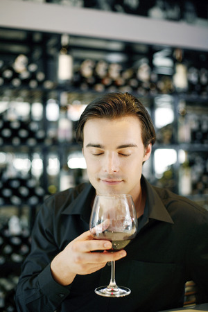Man enjoying a glass of wineの写真素材