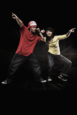 Young man and woman posing for the cameraの写真素材