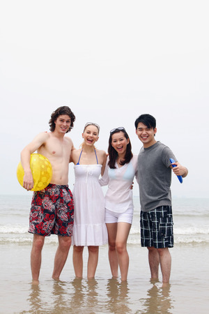 Men and women having fun on the beachの写真素材