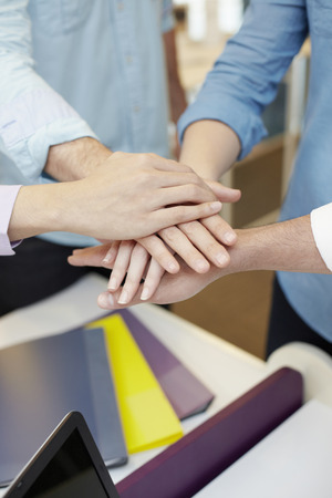 Business people holding hands in circleの写真素材