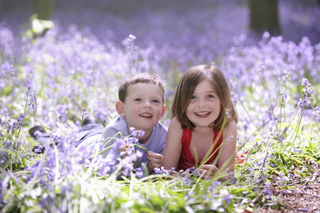 Boy and girl in field of flowersの写真素材
