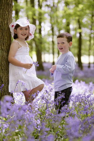 Boy and girl in field of flowersの写真素材