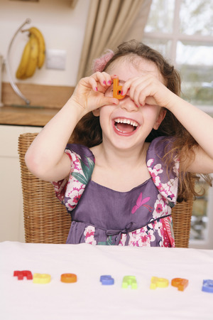 Girl playing with her toysの写真素材