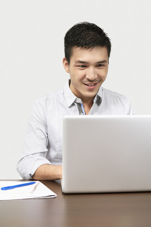 Businessman working on his laptopの写真素材
